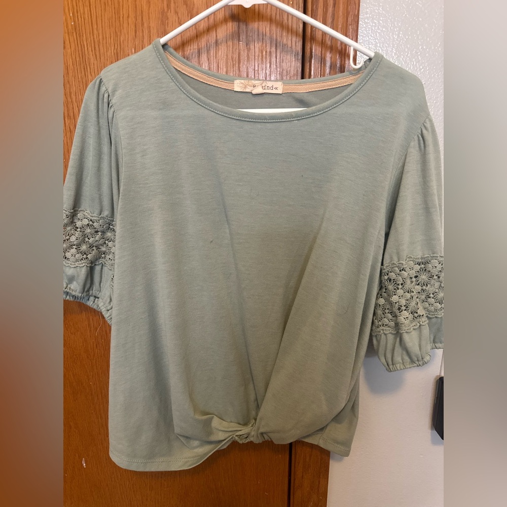light green short sleeve top w twist bottom , crochet sleeve trim  detail